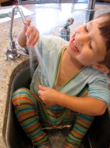 toddler in sink