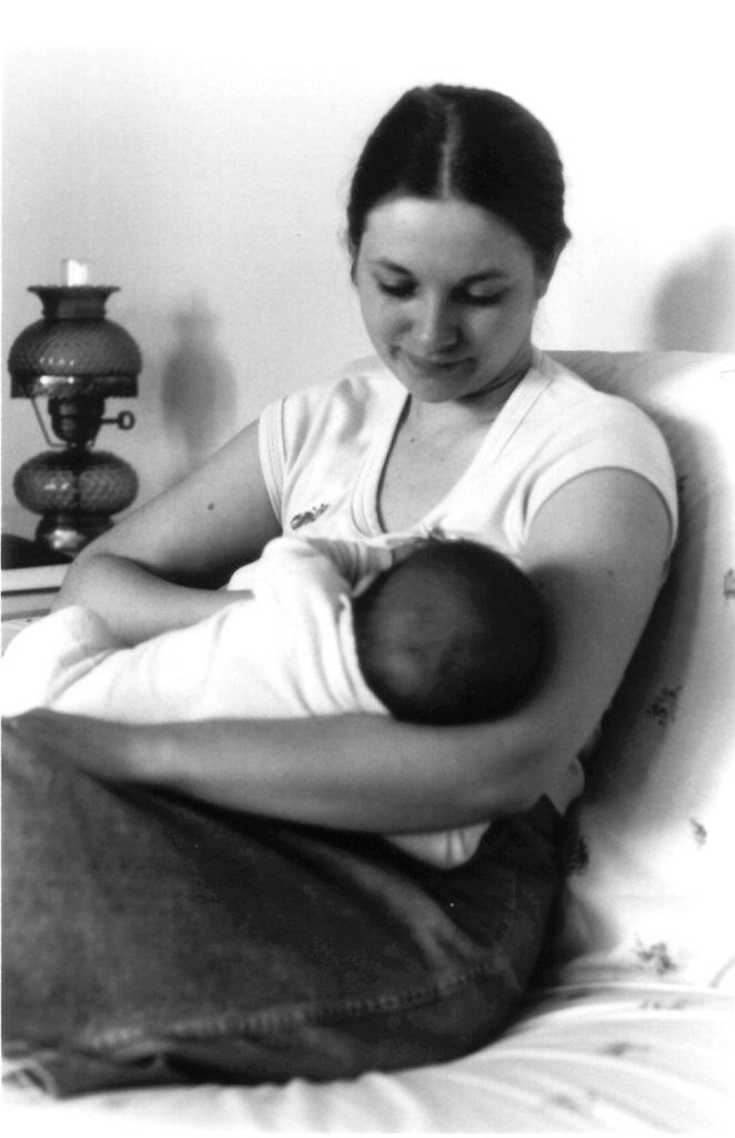 My mother nursing my baby brother.